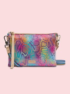 WHAT MAKES IT RIDICULOUSLY AWESOME Keep your phone, keys, and wallet in this take-anywhere crossbody! An open pocket and a credit card slot pocket make this colorful crossbody bag a go-to for heading out the door. DETAILS & SIZING Steph ConsuelaCloth™ exterior Zipper closure Interior slide pocket and credit card slots Includes detachable and adjustable woven crossbody strap Trimmed in natural, untreated leather 8 ¼" (W at the base), 9 ¼” (W at the top) x 5 ¾” (H) x 2" (D), 14 ½”-27 ½” adjustable Spring Travel Bags With Interior Card Slots, Trendy Travel Crossbody Wallet, Multicolor Wallets With Mobile Phone Bag For Everyday, Trendy Travel Wallets Crossbody Style, Trendy Multicolor Phone Bag For Travel, Multicolor Wallets With Mobile Phone Bag, Multicolor Phone Bag With Cell Phone Pocket For Travel, Casual Multicolor Phone Bag With Cell Phone Pocket, Multicolor Phone Bag With Cell Phone Pocket