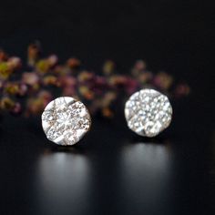 "7 Diamond set in an illusion setting to create a 6 mm round ear studs. These simple earrings are a perfect alternative to bigger solitaire studs. The top will be rhodium plated to provide that solitaire look, in case you don't want it please convo. * Diamond Wt. : 0.48 Cts * Color/Clarity Grade : H-I, Vs-Si * Gold - 14k, 2.1 gms gold (Approx) * Dimension : 6mm x 6mm (approx) If you like this earring, please press \"Pin it\" button on the right of your screen. Find us on Instagram for exquisite Pressure Setting Diamond Earrings, Diamond White Cluster Earrings With Sparkling Stones, Round Diamond Cut Cluster Earrings For Gift, Sparkling Diamond Cluster Earrings, Round Cluster Earrings With Sparkling Stones For Anniversary, Sparkling Round Diamond Cluster Earrings, Anniversary Round Cluster Earrings With Sparkling Stones, Round Cluster Earrings With Sparkling Stones For Gift, Gift Cluster Earrings With Sparkling Stones