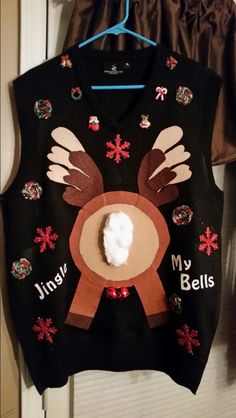 a sweater with a reindeer on it hanging from a door