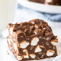 a close up of a piece of cake on a plate with a glass of milk