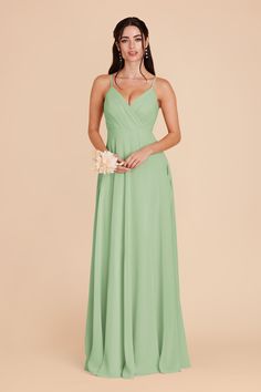 a woman wearing a green bridesmaid dress