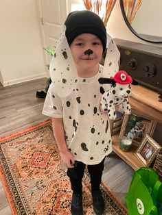 a little boy dressed up as a dalmatian