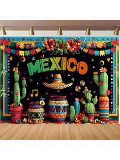 a mexican themed backdrop with cactus and sombrero