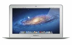 an open macbook air laptop computer on a white background with space in the background