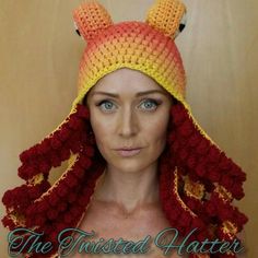 a woman wearing a crocheted hat with ears