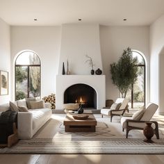 a living room filled with furniture and a fire place in the middle of a room