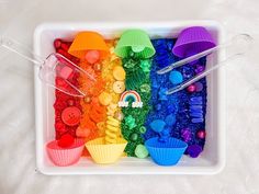 a tray filled with lots of different colored candies