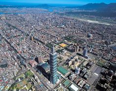 an aerial view of a city with tall buildings