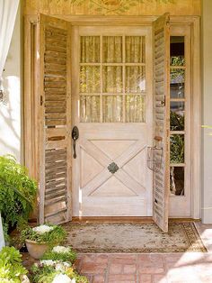 the front door to an old house is open