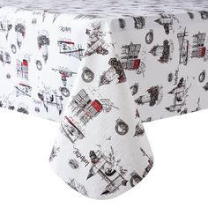 a white table cloth with black and red drawings on it