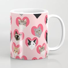 a coffee mug with hearts and cats on it