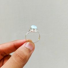 "Important : PLEASE ENTER YOUR PHONE NUMBER IN THE \"NOTE TO SELLER\" SECTION DURING CHECKOUT, SO THAT THE DELIVERY CAN BE HASSLE FREE. Stone : Larimar Metal : 925 Sterling Silver Stone Size : Varies(According to the ring size) Shape : Oval Ships Worldwide from India 925 stamped Handmade Item ABOUT Larimar ♥ Facilitating inner wisdom and outer manifestation Larimar is an earth-healing stone. It connects with nature and will counteract inbalances in the earth's energy, it promotes self-confidence Turquoise Moonstone Ring In Sterling Silver, Silver Larimar Promise Ring, Round Larimar Rings As A Gift, Earth Healing, Ring Everyday, Larimar Ring, Handmade Silver Ring, Larimar Rings, Everyday Ring