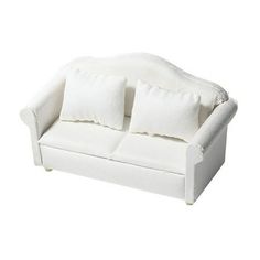 a white couch with two pillows on it's back and the seat upholstered