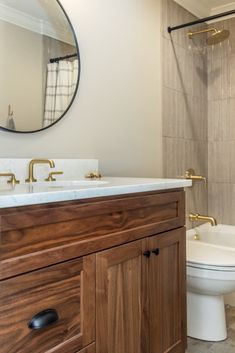 Click to see more of this bathroom remodel featured on our blog! Neutral Bathroom Design, Neutral Bathrooms Designs, Laundry Storage Solutions, Transitional Interior Design, Before After Kitchen, Neutral Bathroom, Natural Bathroom, Cabinet Detailing, Traditional Cabinets