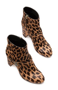 Complete your look with the lively, energetic style of an animal-spotted calf-hair boot lifted by a block heel. 3 1/4" heel; 4 1/4" shaft Side zip closure Genuine calf-hair (Vietnam) upper/textile and leather lining/leather sole Imported Calf Hair Ankle Boots For Fall, Chic Leopard Print Leather Boots, Chic Calf Hair Boots With Round Toe, Chic High Heel Leopard Print Boots, Chic Leopard Print High Heel Boots, Calf Hair, Kate Spade New York, Bootie, Side Zip