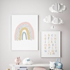 a child's room with toys and artwork on the wall, including an art print