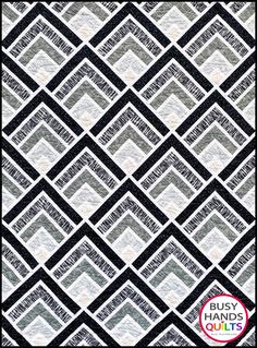 a black and white quilt with squares on it