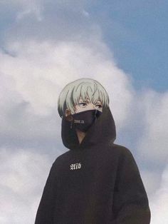 a person wearing a black hoodie with the sky in the background and clouds behind them