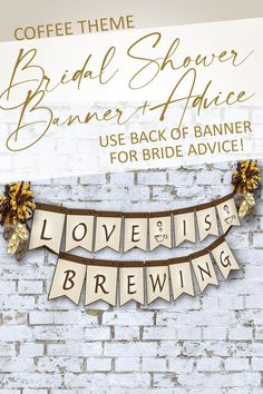 the bridal shower banner is hanging on a brick wall with flowers and ribbons around it