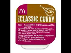 a container of macaroni and cheese sauce with the words'classic curry'on it