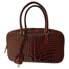 Prada bag in brown crocodile Very good condition, opacification on the bottom of the bag Width:22 cm Height:13 cm Depth:6 cm Brown Crocodile Pattern Bags For Office, Designer Brown Shoulder Bag With Crocodile Pattern, Classic Brown Bag With Crocodile Pattern, Elegant Brown Crocodile Pattern Bag, Luxury Brown Crocodile Pattern Bag, Prada Purses, Crocodile Bags, Brown Leopard, Berets