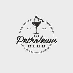 the petroleum club logo with a martini glass in it's center and an arrow pointing up