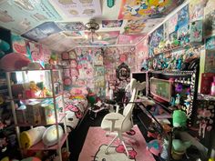 a room filled with lots of hello kitty decorations and accessories on the walls, floors, and ceiling