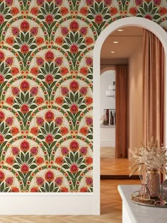 an ornate wallpaper design with orange and red flowers on it in a living room