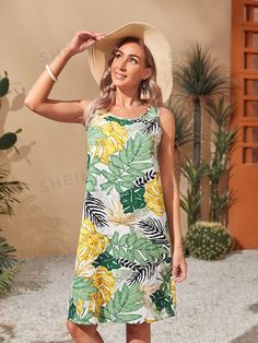 Expertly crafted with a scoop neck and tropical print, our Exotic Elegance dress is the epitome of chic and sophisticated style. Made with high-quality materials, it effortlessly showcases a tropical flair that will make you stand out in any setting. Embrace the benefits of effortless elegance with this stunning dress. Color : Multicolor Style : Boho Type : Tank Pattern Type : Tropical Sleeve Length : Sleeveless Neckline : Round Neck Waist Line : Natural Hem Shaped : Straight Length : Knee Length Fit Type : Regular Fit Fabric : Non-Stretch Material : Fabric Composition : 95% Polyester, 5% Elastane Care Instructions : Machine wash or professional dry clean Sheer : No Size US Bust Hip Size Length Shoulder Waist Size S 4 36.8 41.1 37.4 13.4 38.2 M 6 38.4 42.7 38.2 13.6 39.8 L 8/10 40.7 45.1 3 Tropical Sleeve, Tank Pattern, Elegance Dress, Scoop Neck Dress, Effortless Elegance, Navy Blue Dresses, Style Boho, Smock Dress, Tropical Print