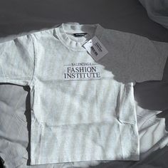 Authentic Kids Balenciaga Tee Brand New W/ Tags Runs Small Trendy Gray Tops With Letter Print, Trendy Gray Top With Text Print, Trendy Gray Tops With Logo Print, Gray Letter Print Tops For Spring, Basic Gray Top With Logo Print, Balenciaga Tshirt, Balenciaga Top, Balenciaga Shirt, Balenciaga T Shirt