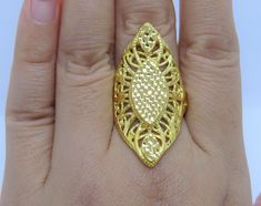 Vintage 24K 999 Pure Gold Filigree Long Ring...Marked 999 ...Weights 3.6grams...Measure of Face 37.8MM ...Size 7.75....It's in very good condition. Gold Oval Filigree Ring Hallmarked, Traditional Gold Engraved Filigree Ring, Traditional Engraved Gold Filigree Ring, Ornate Gold Filigree Ring For Ceremonies, Ornate Gold Oval Filigree Ring, Traditional Oval Filigree Ring, Handmade Gold Filigree Ring For Formal Occasions, Handmade Gold Oval Filigree Ring, Ceremonial Gold Filigree Ring