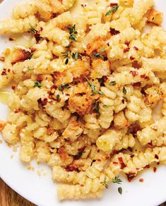 a white plate topped with macaroni and cheese