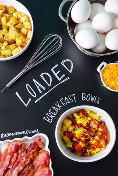 the ingredients for loaded breakfast bowls laid out on a chalkboard