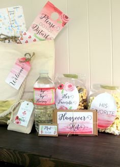 a wooden table topped with lots of bottles and bags filled with items to give someone