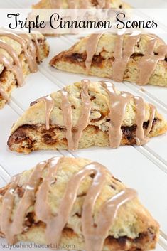 some type of cinnamon scones with icing on top and chocolate drizzle