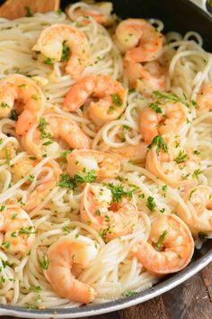 pasta with shrimp and parsley in a pan