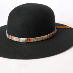 Woven cotton hat band with variations of red and blue. This band comes with detailed metal conchos. Adjustable with brown leather tie. Handmade in Guatemala Adjustable hatband *This product is for 1 single hat band. Hat not included. Adjustable Flat Crown Hat For Fall, Adjustable Casual Felt Hat With Flat Crown, Handmade Adjustable Fedora For Fall, Adjustable Brown Hat Bands For Fall, Adjustable Hat Bands For Country Events In Fall, Country Style Adjustable Felt Hat With Short Brim, Adjustable Country Style Fedora Felt Hat, Country Style Hat Band With Flat Crown For Winter, Brown Adjustable Hat For Festivals