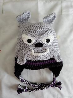 a crocheted hat with eyes and ears