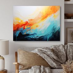 an abstract painting hangs on the wall above a couch in a room with white walls