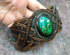 Green Bohemian Bracelets With Patina, Handmade Green Leather Bracelet, Bohemian Hand Tooled Green Jewelry, Green Leather Artisan Jewelry, Green Artisan Bracelet With Patina, Artisan Green Bracelet With Patina, Artisan Green Patina Bracelets, Green Leather Jewelry For Gifts, Green Leather Jewelry Gift