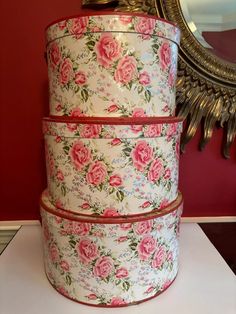 three floral boxes stacked on top of each other