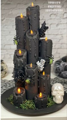 a cake made to look like it has candles in the shape of castles and skulls