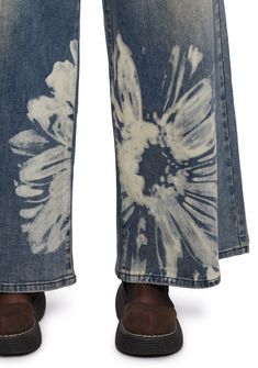 These jeans have a soft washed denim construction, a bleached floral pattern on the front and back, a wide leg silhouette, front and back pockets, and a front zipper and button closure. Current Mood Clothing, Get A Life, The Terrace, Current Mood, Washed Denim, Dolls Kill, Denim Wash, Wide Leg Jeans, Cargo Pants