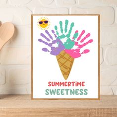 a poster with the words summertime sweetness and handprints on it next to a wooden spoon