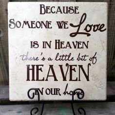 a sign that says because someone we love is in heaven there's a little bit of heaven on our heart