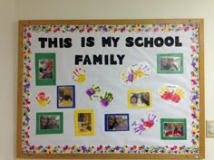 this is my school family bulletin board with handprints and pictures on the front