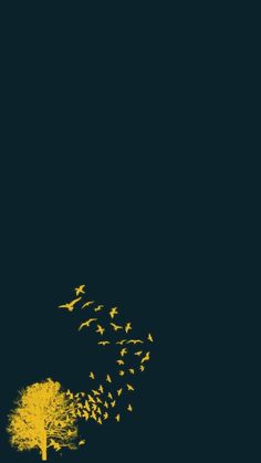 a flock of birds flying over a tree on a dark night with the moon in the sky