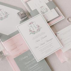 the wedding stationery is laid out on the table