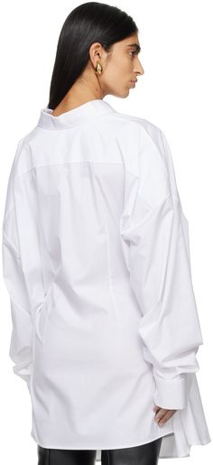 Cotton poplin shirt. · Spread collar · Button closure · Patch pocket at chest · Shirttail hem · Dropped shoulders · Single-button barrel cuffs · Twin vents at back hem Supplier color: White Oversized Tops With Button Cuffs And Spread Collar, White Poplin Tops With Button Cuffs, White Poplin Top With Spread Collar, Long Sleeve Poplin Dress Shirt For Work, White Long Sleeve Poplin Shirt, White Long Sleeve Poplin Tops, Collared Poplin Top With Button Closure, Collared Poplin Tops With Button Closure, Oversized Office Tops With Placket