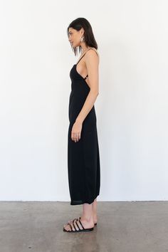 Meet the Demi dress, a 90’s inspired silhouette. Fits close to the body with a square neckline and exposed back. Black - 100% Rayon Dry Clean only. Fully lined. Cris is 5'9 / 175 cm and wearing a size 1 which is equivalent to a size Small. Fitted Slip Dress With Back Opening For Date Night, Fitted Maxi Length Slip Dress With Ruched Back, Fitted Maxi Slip Dress With Ruched Back, Fitted Midi Slip Dress With Ruched Back, Fitted Slip Dress With Ruched Back, Maxi Length, Maxi Slip Dress With Back Opening For Night Out, Fitted Square Neck Midi Dress With Tie Back, Tie-back Midi Dress For Night Out, Fitted Tie-back Midi Dress For Date Night